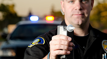 https://www.thecommunityguide.org/media/images/MVI.Officer-With-Breathalyzer-F51711988.jpg