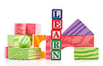 Alphabet blocks spell LEARN in a colorful arrangement, represents early childhood education programs to promote health equity. 