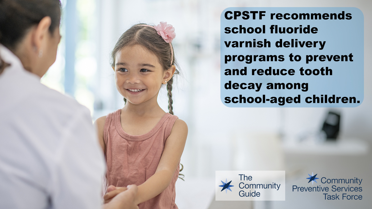 Use this image of a young girl with a pink hair ribbon talking to a health care professional to promote the CPSTF effectiveness finding for School Fluoride Varnish Delivery Programs on your social media accounts.