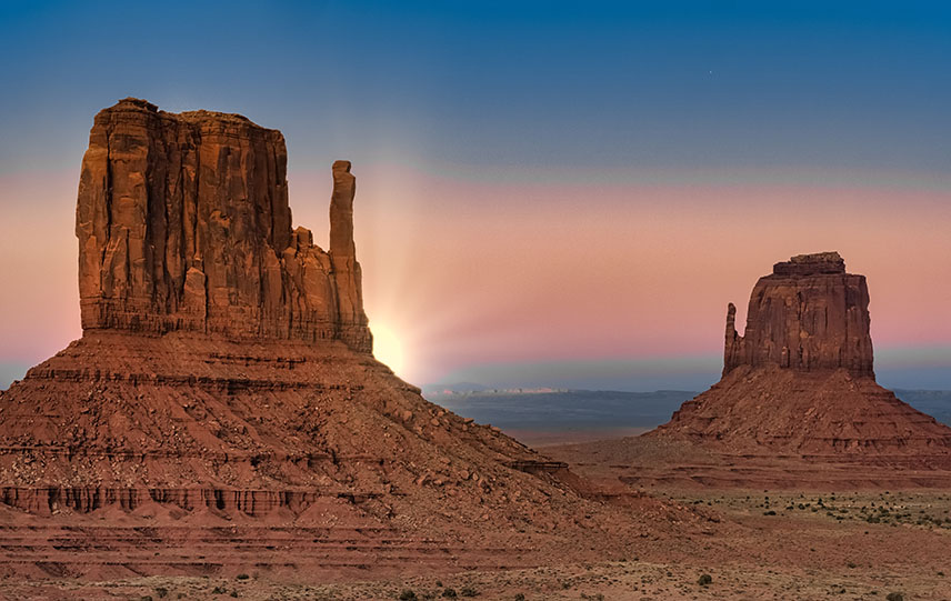 Sunset behind a mesa in Monument Valley Navajo Tribal Park, Arizona